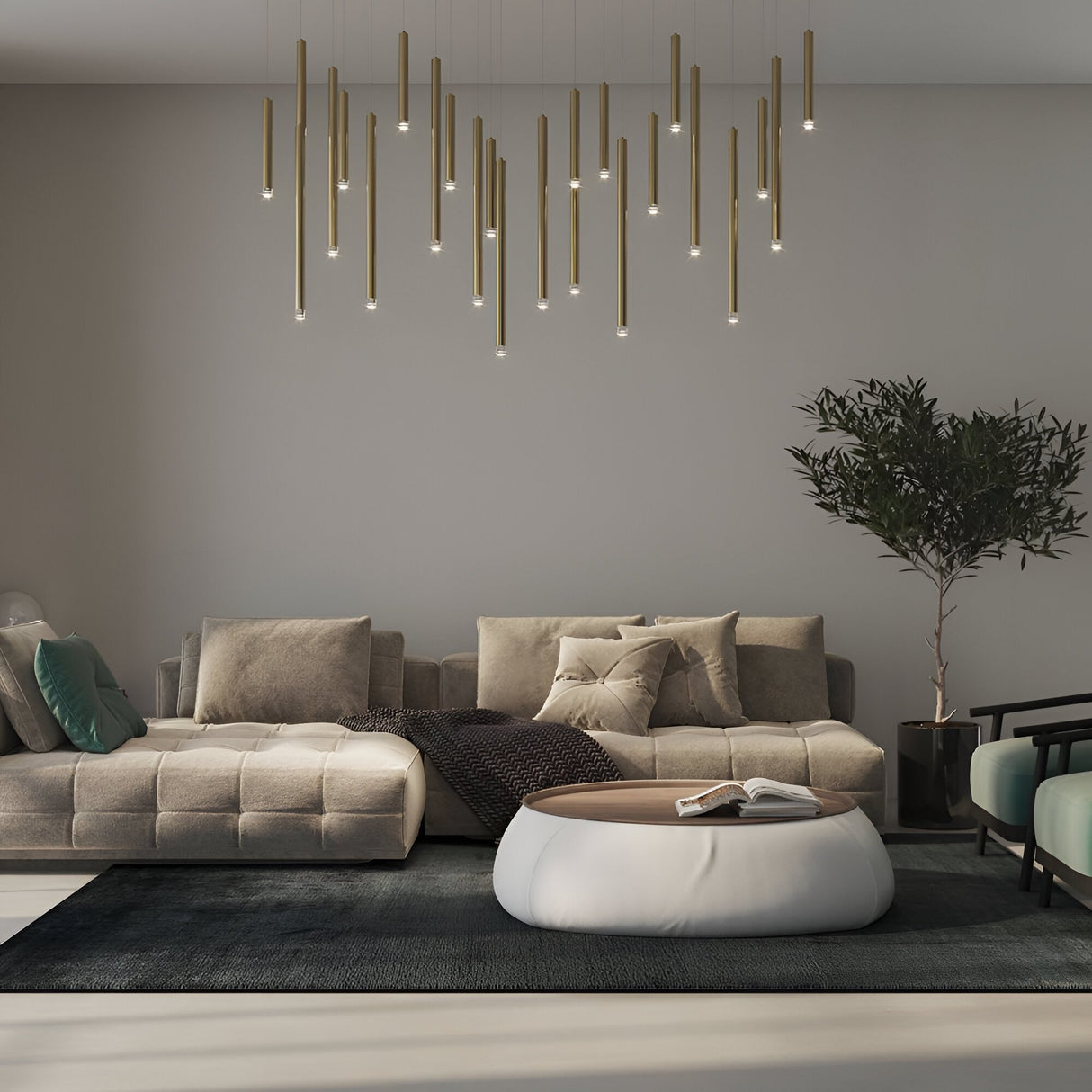 A modern living room features beige sofas, a round white coffee table, a dark rug, a tall potted plant, and the Micro LED Pendant Light - Gold hanging from the ceiling against a light gray wall.