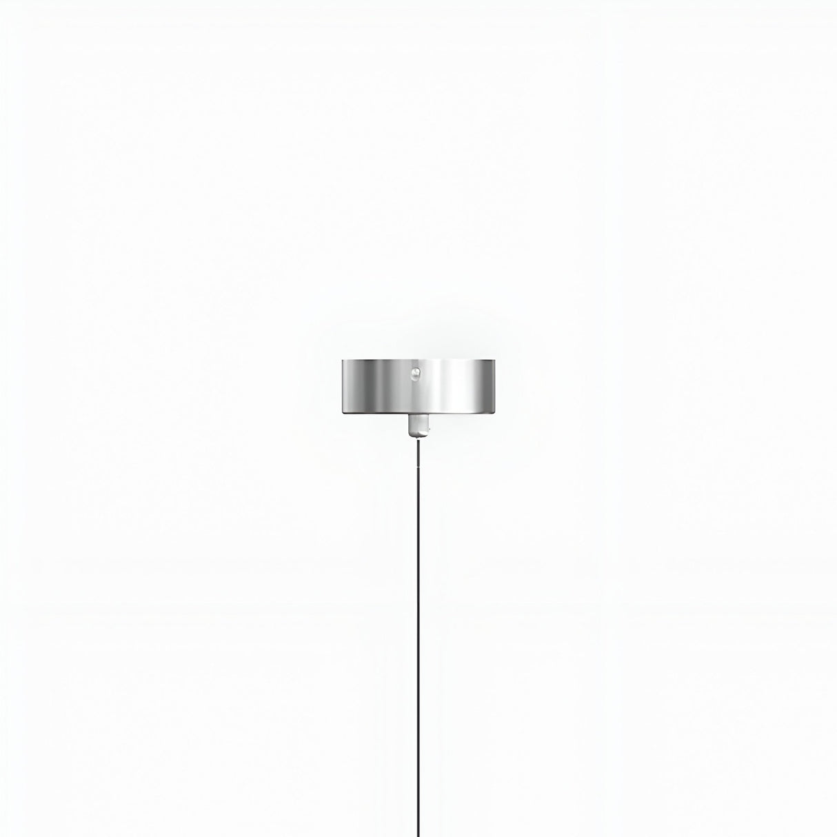 The Micro LED Pendant Light - Silver features a modern, minimalist cylindrical metallic shade on a slim vertical cord, shown centered against a plain white background.