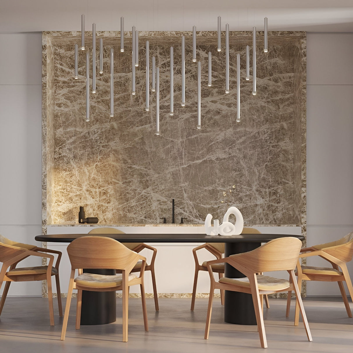 Modern dining area with a black table, six wooden chairs, sculptural white centerpiece, marble wall backdrop, and the Micro LED Pendant Light - Silver. This sleek lighting fixture elevates the room�E€�Es elegant, minimalist style.