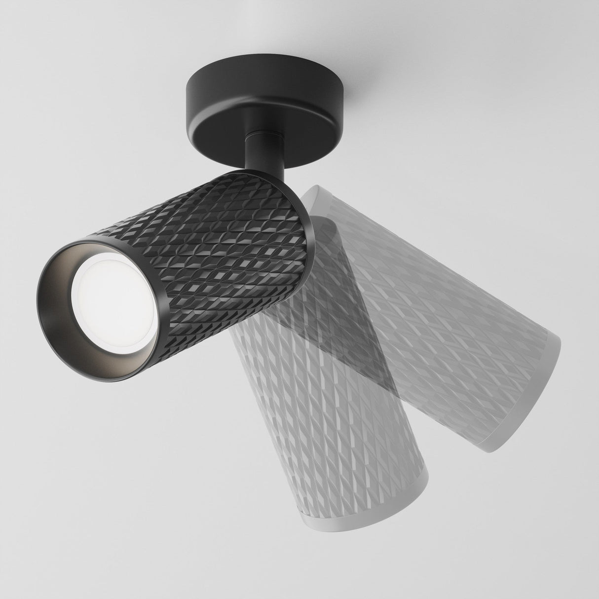 The Focus Design Single Spotlight - Black features a modern textured cylindrical look with an adjustable swivel design. It mounts on the ceiling via a circular base and uses a GU10 bulb.