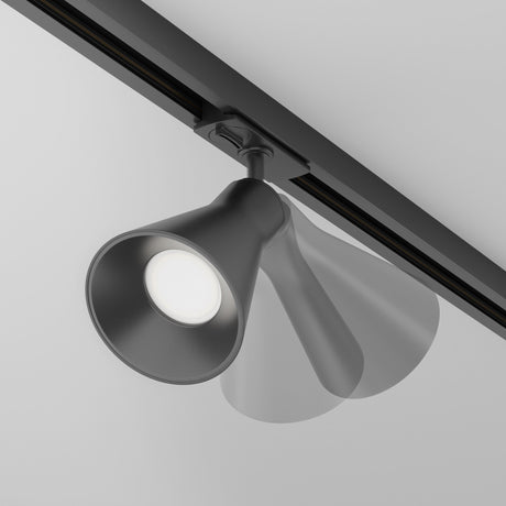 The Virar Single Phase Unity Track Spotlight in black, with energy-efficient LED bulbs, is ceiling-mounted and displayed dynamically to show its motion range. It emits bright white light, accentuating its sleek, modern design.