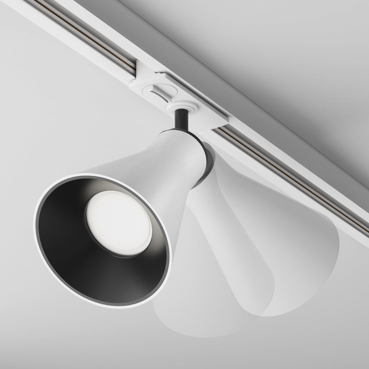 The Virar Single Phase Unity Track Spotlight - White is a modern ceiling rail fixture with a sleek conical design, featuring a GU10 lamp base for bright illumination and contemporary minimalist style.