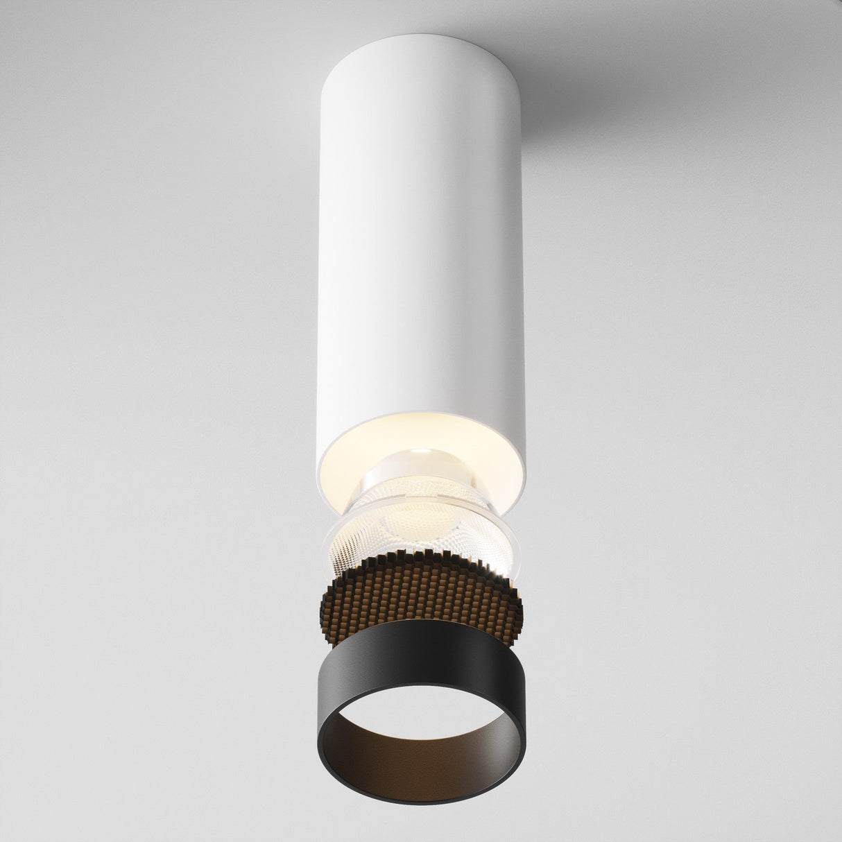The Focus LED Dimmable Fixed Round Surface Mounted Downlight 12W 3000K - White features a sleek white cylindrical design with a black ring around the exposed bulbs base, offering modern, minimalist energy-efficient lighting.