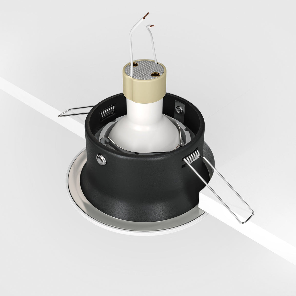 The Yin Round Recessed Downlight - White features a black housing with metal brackets and an energy-efficient LED source. It installs easily with wires protruding from the top and offers sleek, modern elegance when partially embedded in a white ceiling.