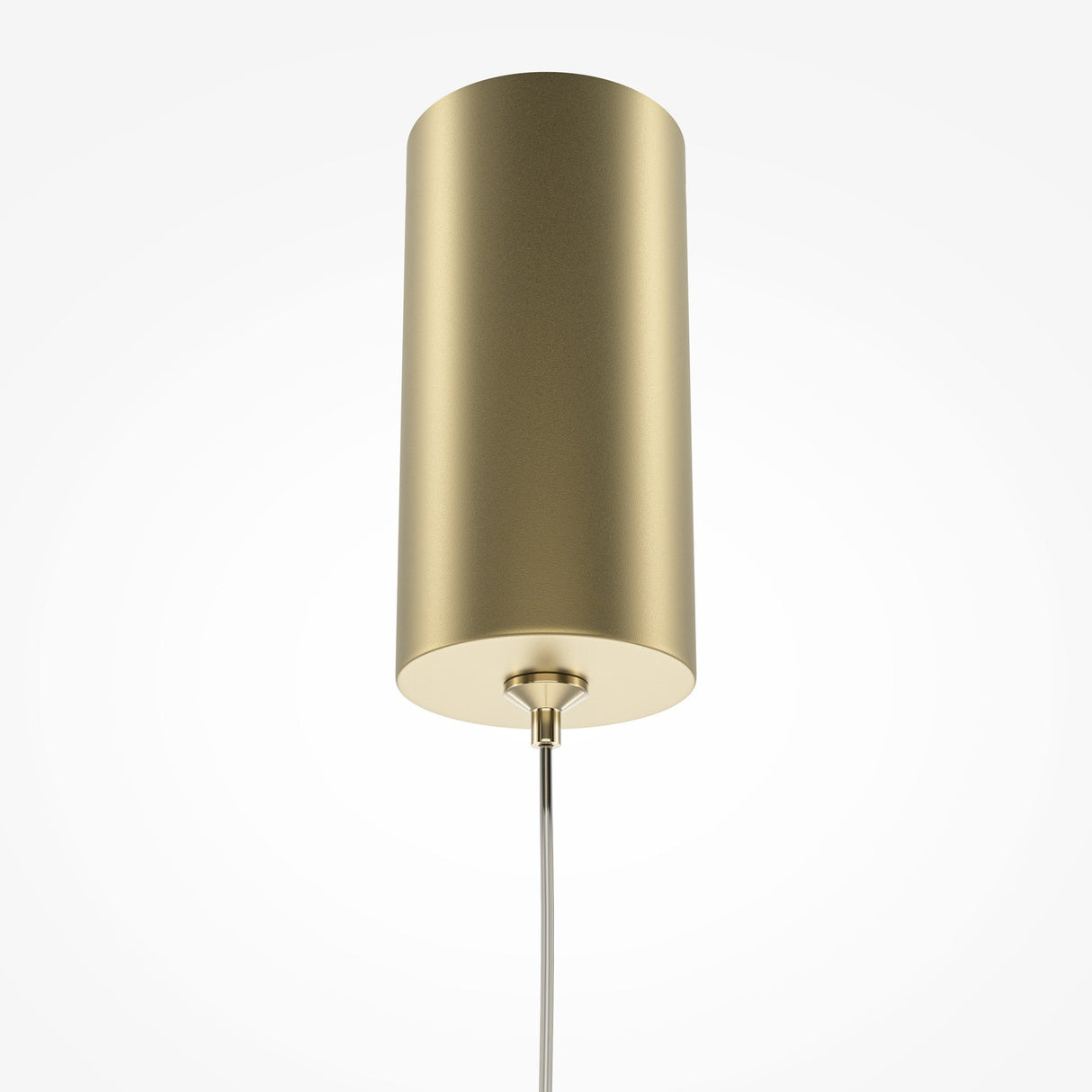 The Pro Base LED Thin Pendant Light - Gold, featuring a cylindrical design and brushed gold finish, hangs from the ceiling. Its minimalistic style includes an integrated LED light source and a sleek supporting wire, all set against a plain white background.