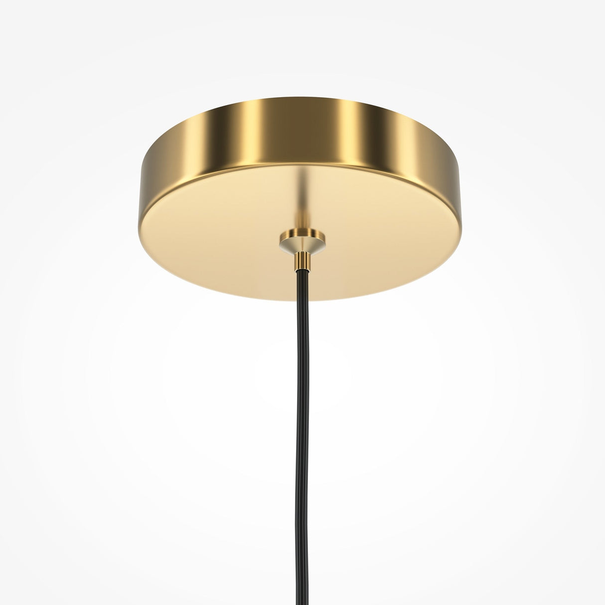 Close-up of the Pro Focus Thin Pendant Light - Brass, showcasing a modern elegance with a round gold-colored base. A black cord extends gracefully downward from the center, set against a plain white background to highlight its minimalist interior lighting appeal.