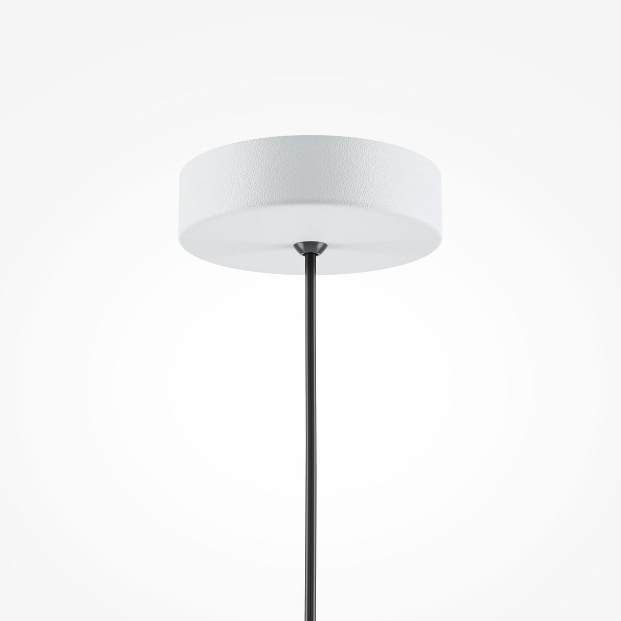 The Basic Colors Cone Pendant Light - White is a modern piece with a minimalist design, featuring a white, round shade and a black cord elegantly hanging against a simple white backdrop.