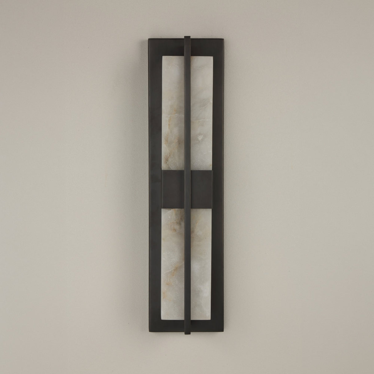 Niori Caldera LED Alabaster Wall Light Small in matt black, featuring two vertical alabaster panels split by a central bar, mounted on a pale wall.