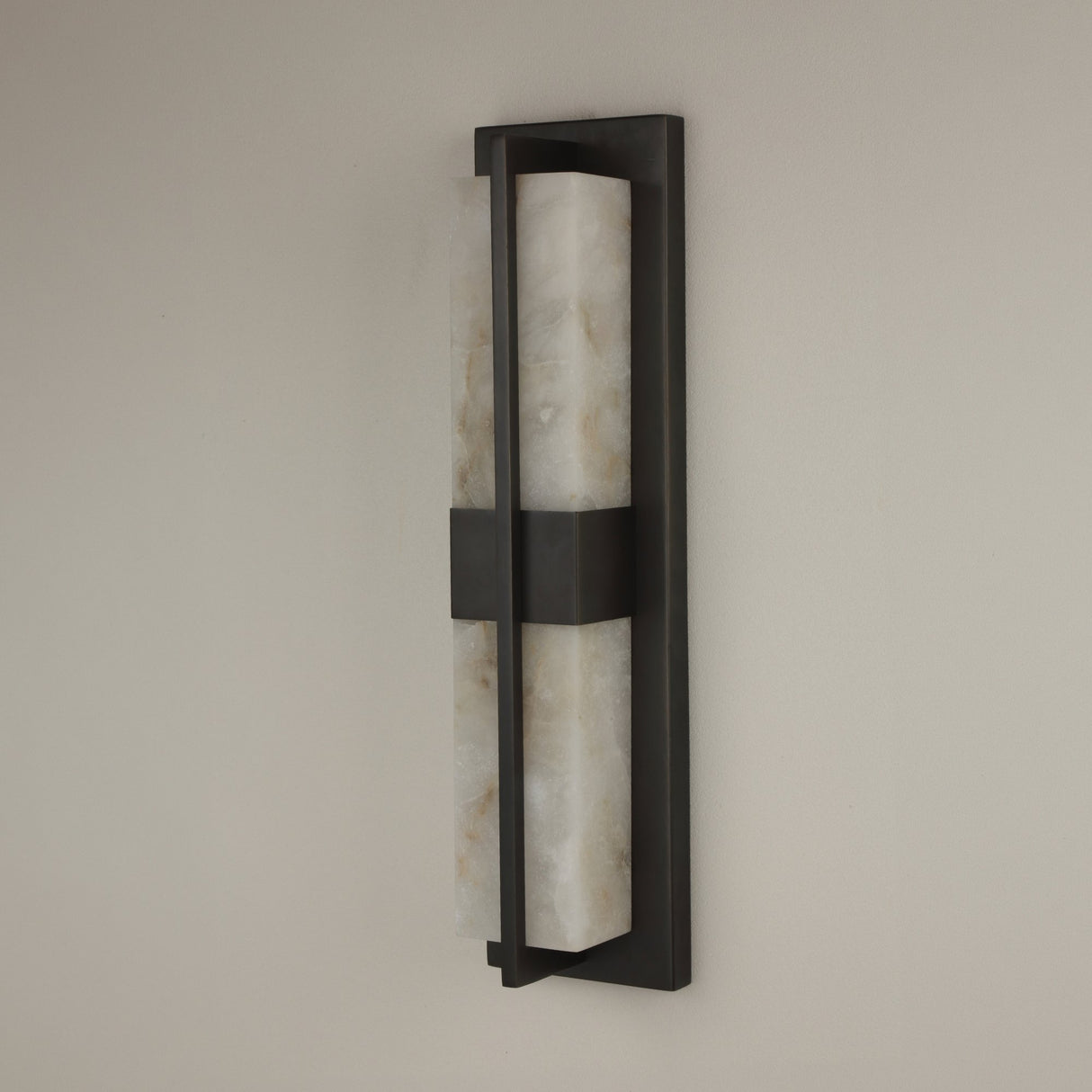 Niori Caldera Small LED wall light with two vertical Spanish alabaster panels split by a matt black bar within a rectangular copper frame.