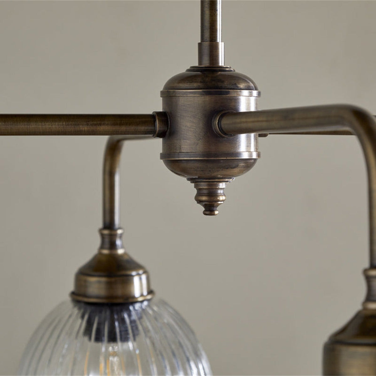 Kakira Ribbed Glass 6 Light Chandelier - Clear & Antique Brass in a kitchen, view 2