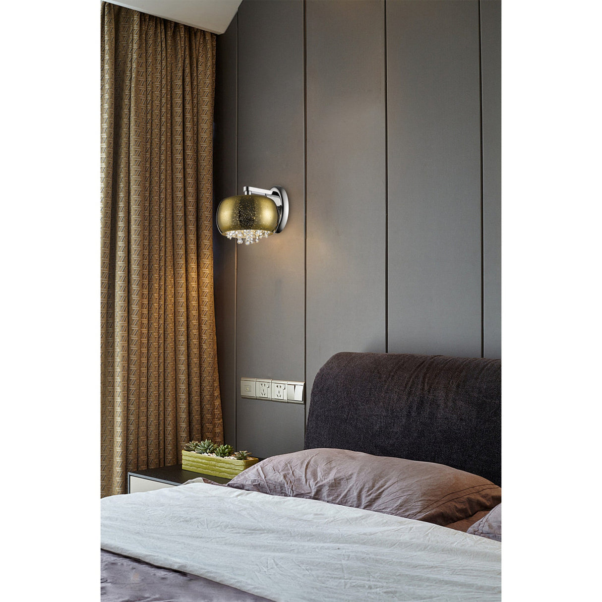 Impex Lunara 1 light wall fitting with gold-smoked hemispherical glass shade, polished chrome bracket and crystal droplets, mounted in a grey bedroom.