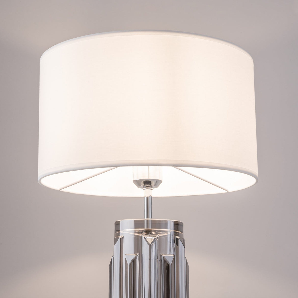 Additional perspective of Muse Table Lamp in grey with white shade, emphasizing the soft, inviting look ideal for various interiors