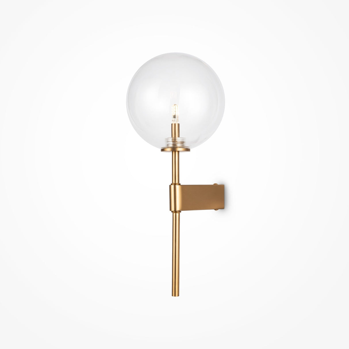 Discover the Mood Wall Light - Brass With Clear Round Glass, featuring a brass fixture and clear glass globe shade. This modern wall sconce includes a single bulb held by a vertical rod attached to a sleek rectangular wall mount, all set against a white background.