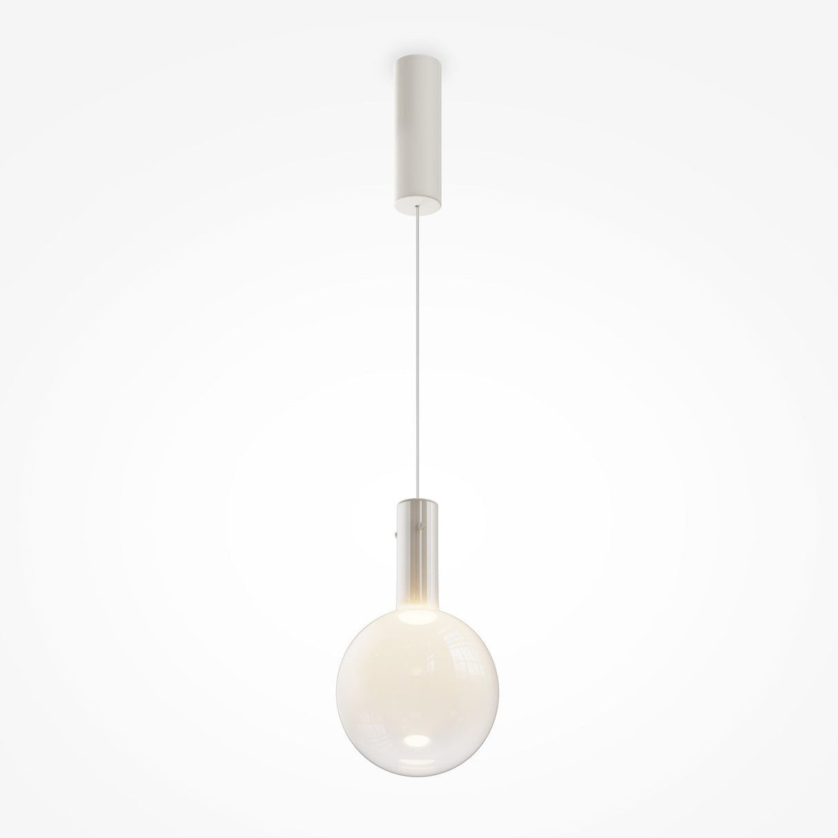 The Nebula LED Pendant Light 20cm showcases a minimalist design with a misty white glass sphere, elegantly suspended on a thin cord. This energy-efficient LED emits a soft glow, enhancing its sophisticated look against a plain white backdrop.