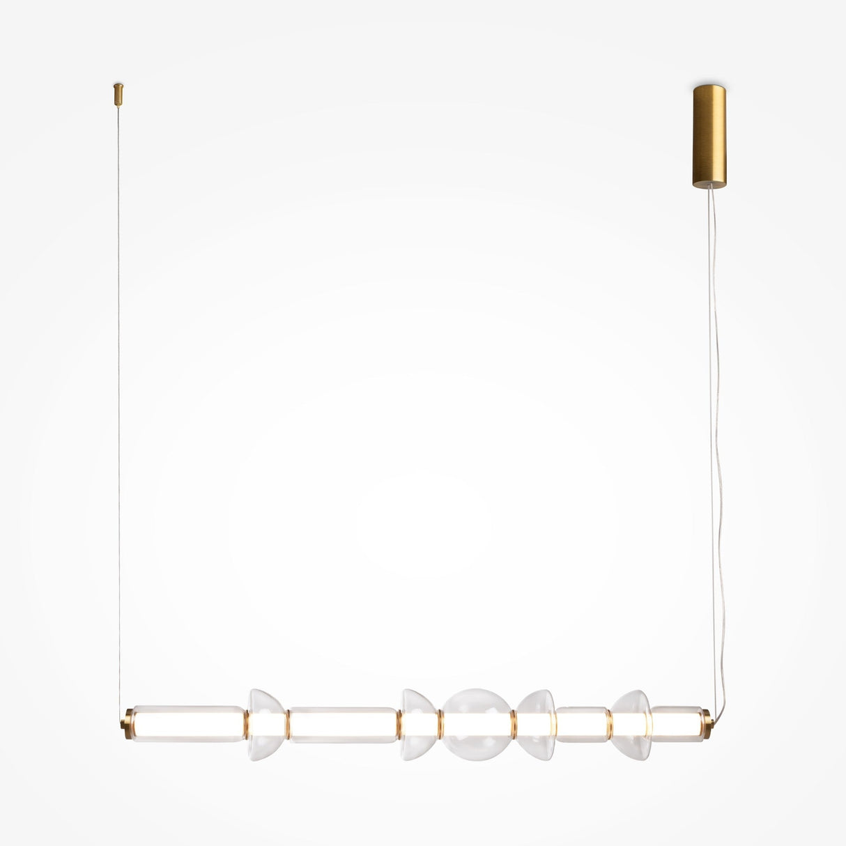 The Cosmo LED Linear Suspension Light features a sleek gold rod and symmetrical conical clear glass elements, creating a celestial design. It hangs from a brass ceiling mount with minimalistic elegance on a white background.