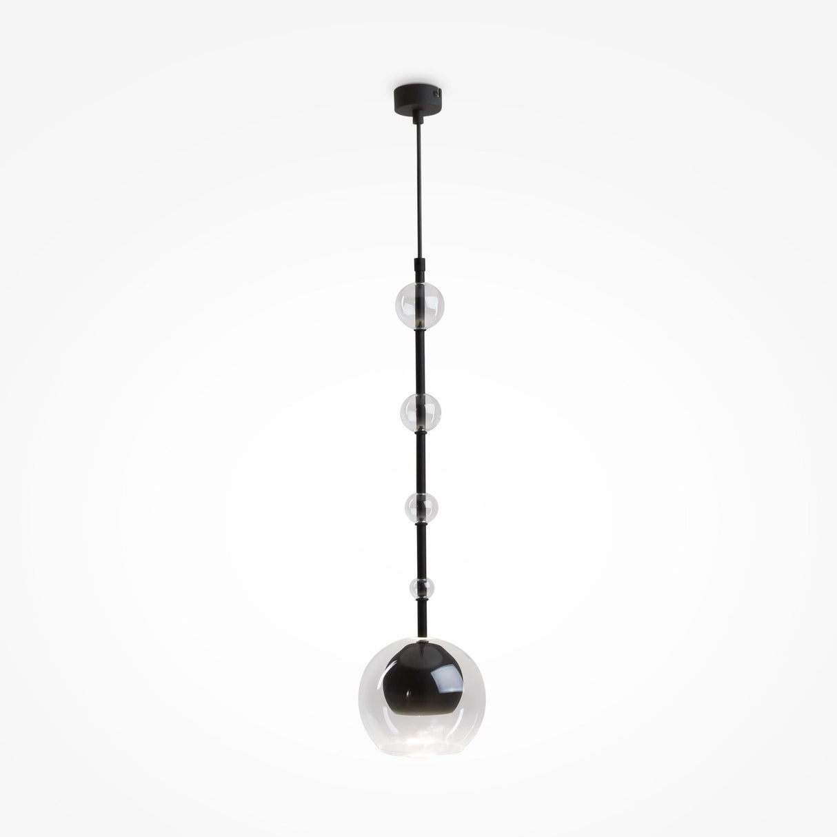 The Ros 1 Light Pendant features a black rod with five vertically arranged clear glass shades of varying sizes. The largest sphere at the bottom houses a bulb. This stylish fixture has an adjustable hanging length and hangs from a black ceiling mount against a white background.