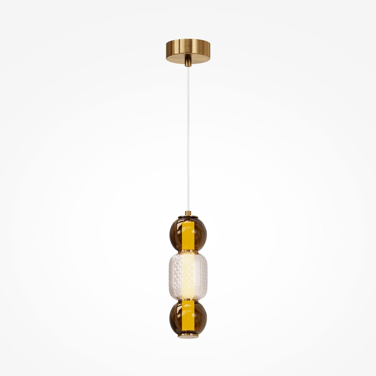 The Drop LED Pendant Light - Gold is a modern pendant featuring a brass ceiling mount and vertical glass fixture with two amber spheres encasing a textured, translucent center. Perfect for modern décor, its white cord offers adjustable lighting to enhance any ambiance.