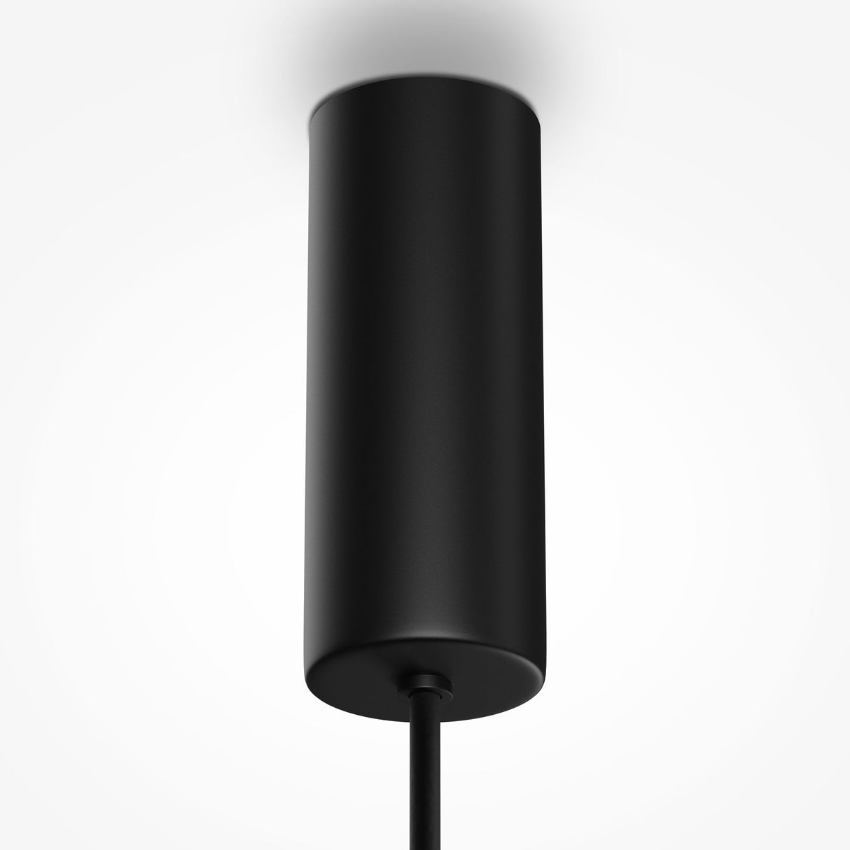 The Gerhard LED Dome Pendant Light 40cm in black hangs from the ceiling, offering energy-efficient lighting. Its sleek, cylindrical design features a smooth surface and a hanging cord. The minimalist piece is emphasized by a plain white background, highlighting its modern style.