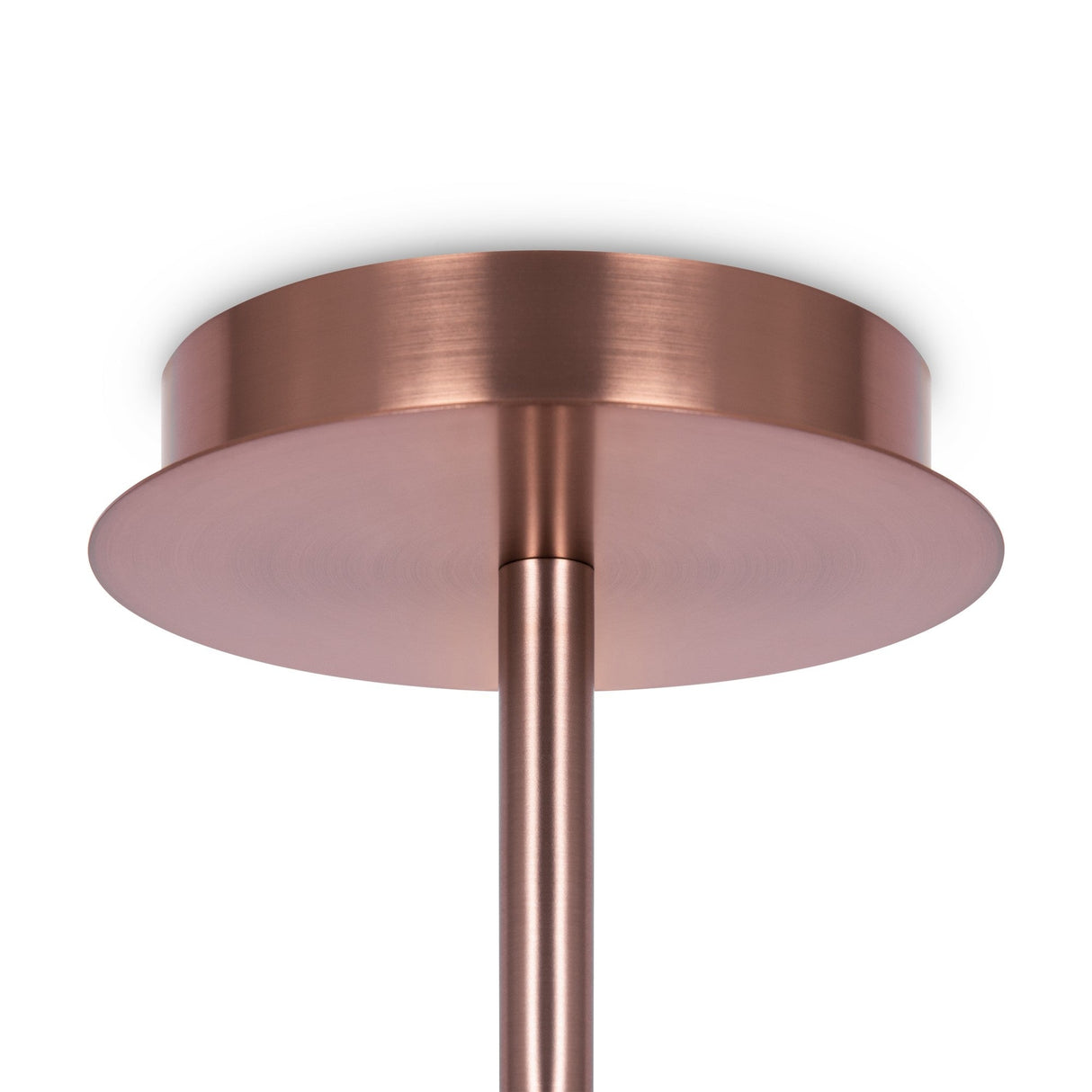 Close-up of a sleek, copper-hued cylindrical ceiling mount with a matching rod extending downward. Its brushed metal surface embodies modern artistry and sophistication, mirroring the elegant design of the Erich 10 Light Semi-Flush - Brass With White Glass.