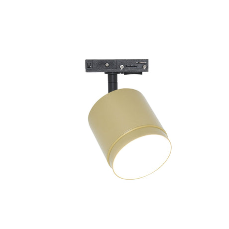 The Polar LED Single Phase Unity Track Spotlight in matte gold features a cylindrical design with a black bracket, ideal for modern interiors. It angles downward for luxury accent lighting, enhancing its minimalist aesthetic.