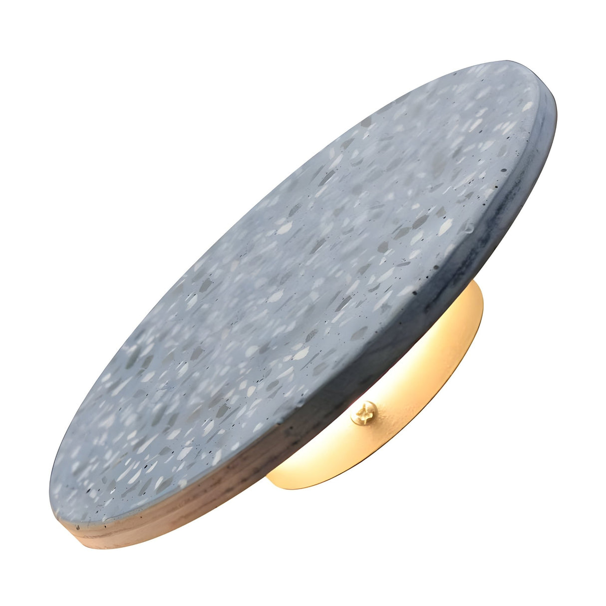 The Pin LED Wall Light features a round terrazzo sconce with a speckled gray and white finish on a brass base, casting a warm ambient halo ideal for modern minimalist spaces.