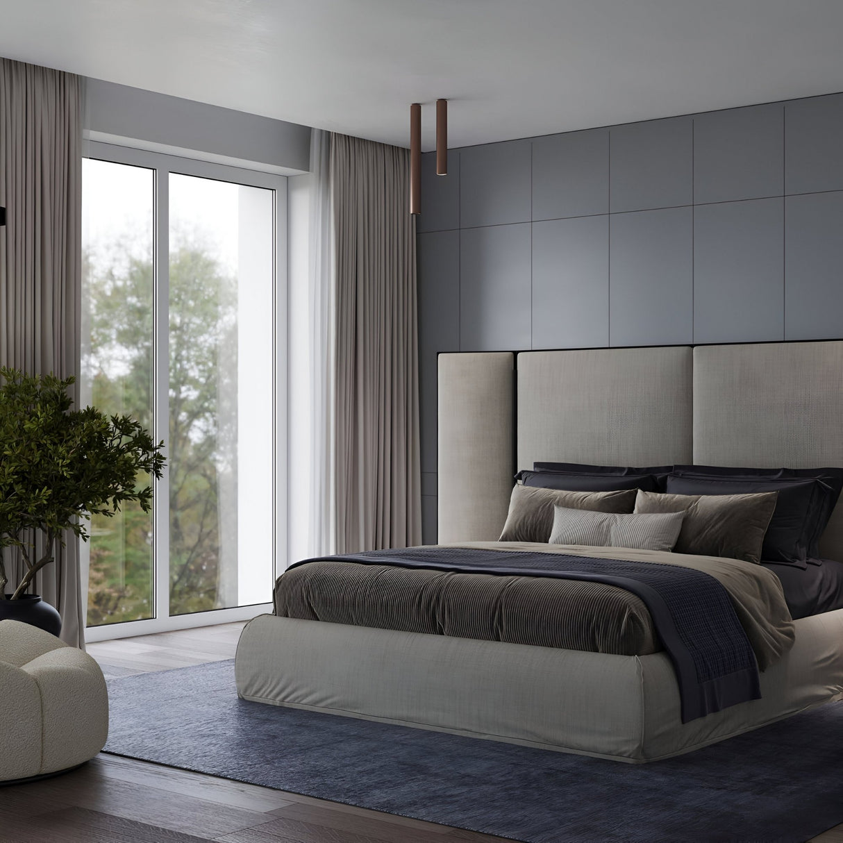 Modern bedroom with a large bed in neutral linens, paneled gray walls, floor-to-ceiling windows with sheer curtains, blue rug, white armchair, potted plant by the window, and the Pulcra Tube Ceiling Light - Copper for a sophisticated touch.