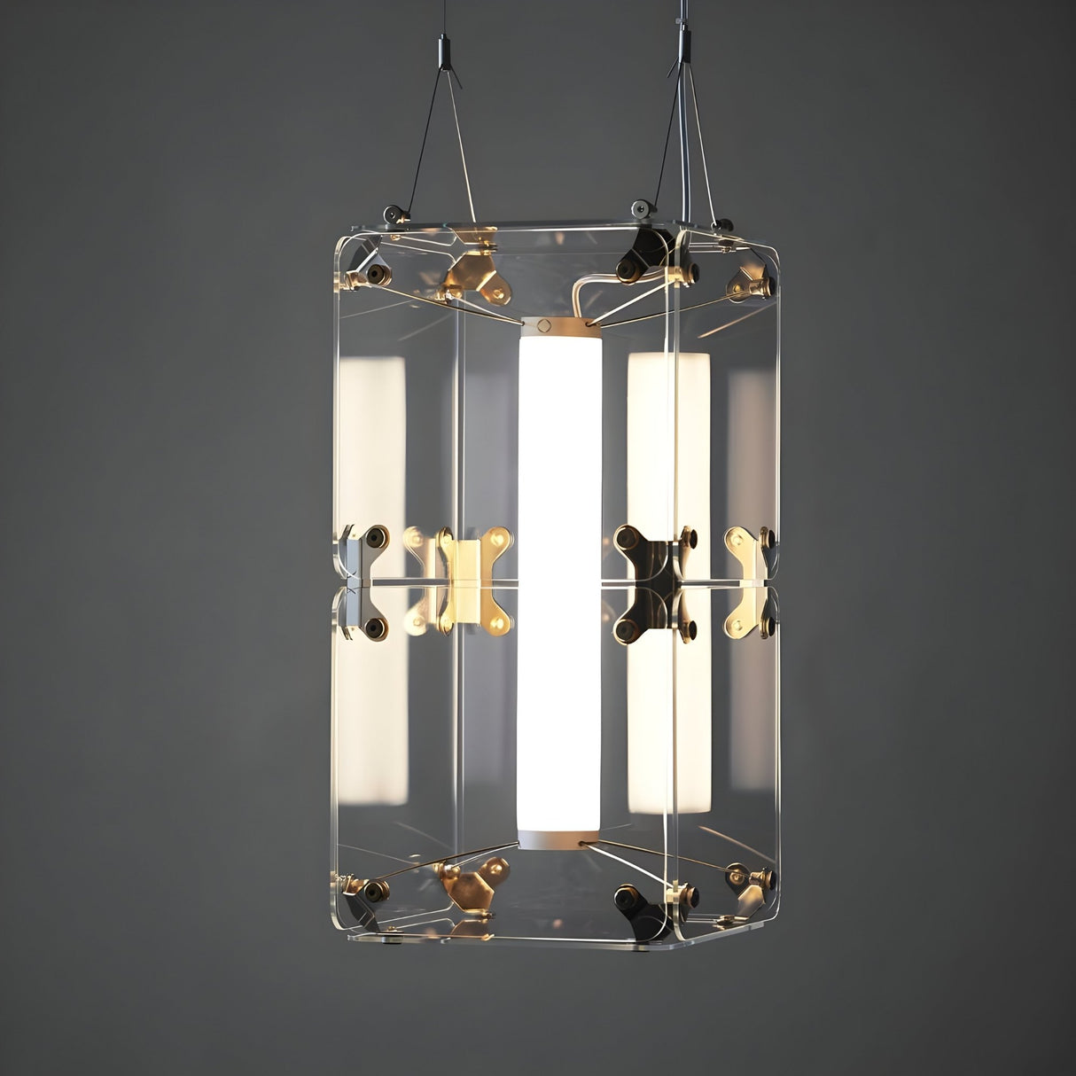 The Qbic LED Small Pendant Light - Clear features transparent panels, metallic fasteners, and a central vertical light source for energy-efficient illumination, suspended by two wires against a plain gray background.