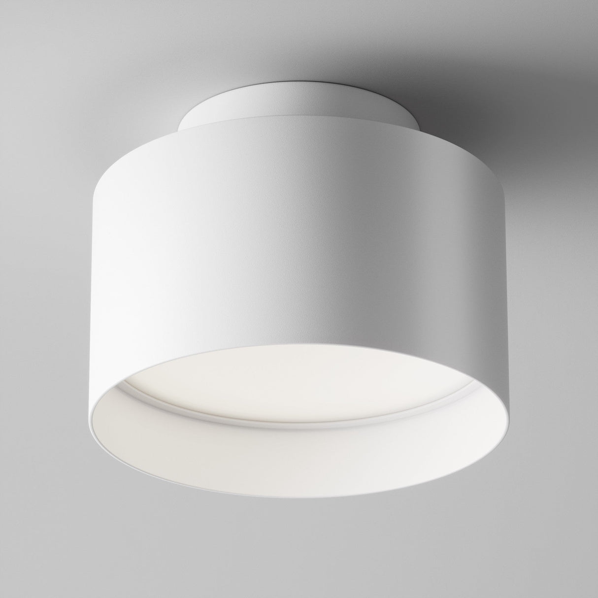 Additional perspective of Planet LED Medium Round Surface Downlight in White, showing its round shape and smooth finish for ambient lighting.