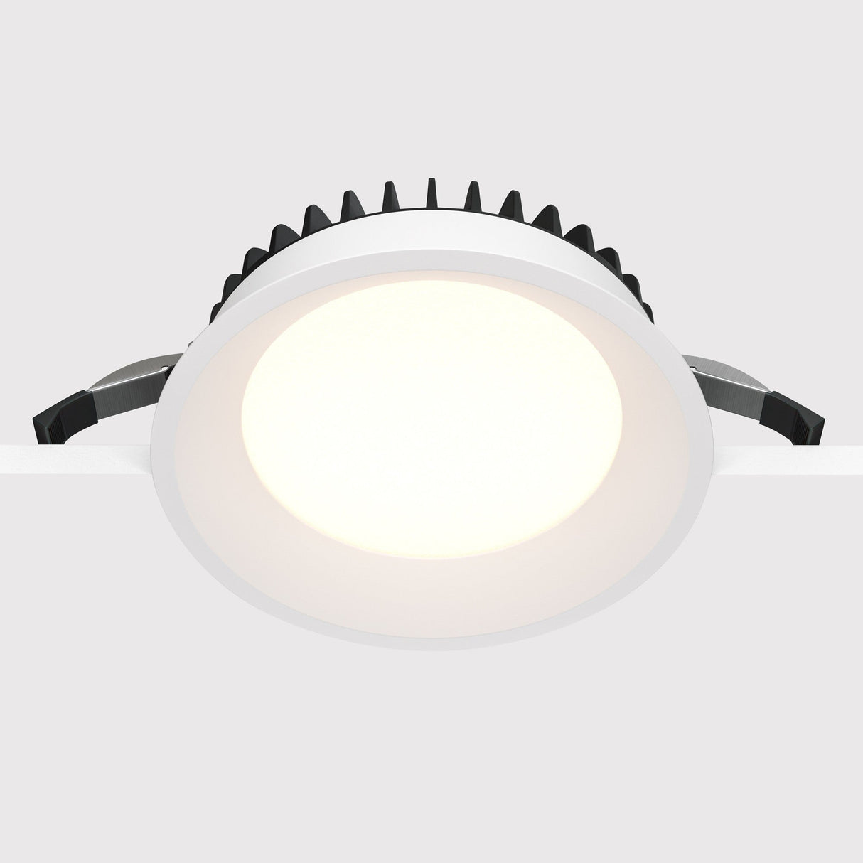 Side view of Okno LED Round Recessed Downlight in white, highlighting the fixture’s elegant curves and discreet design