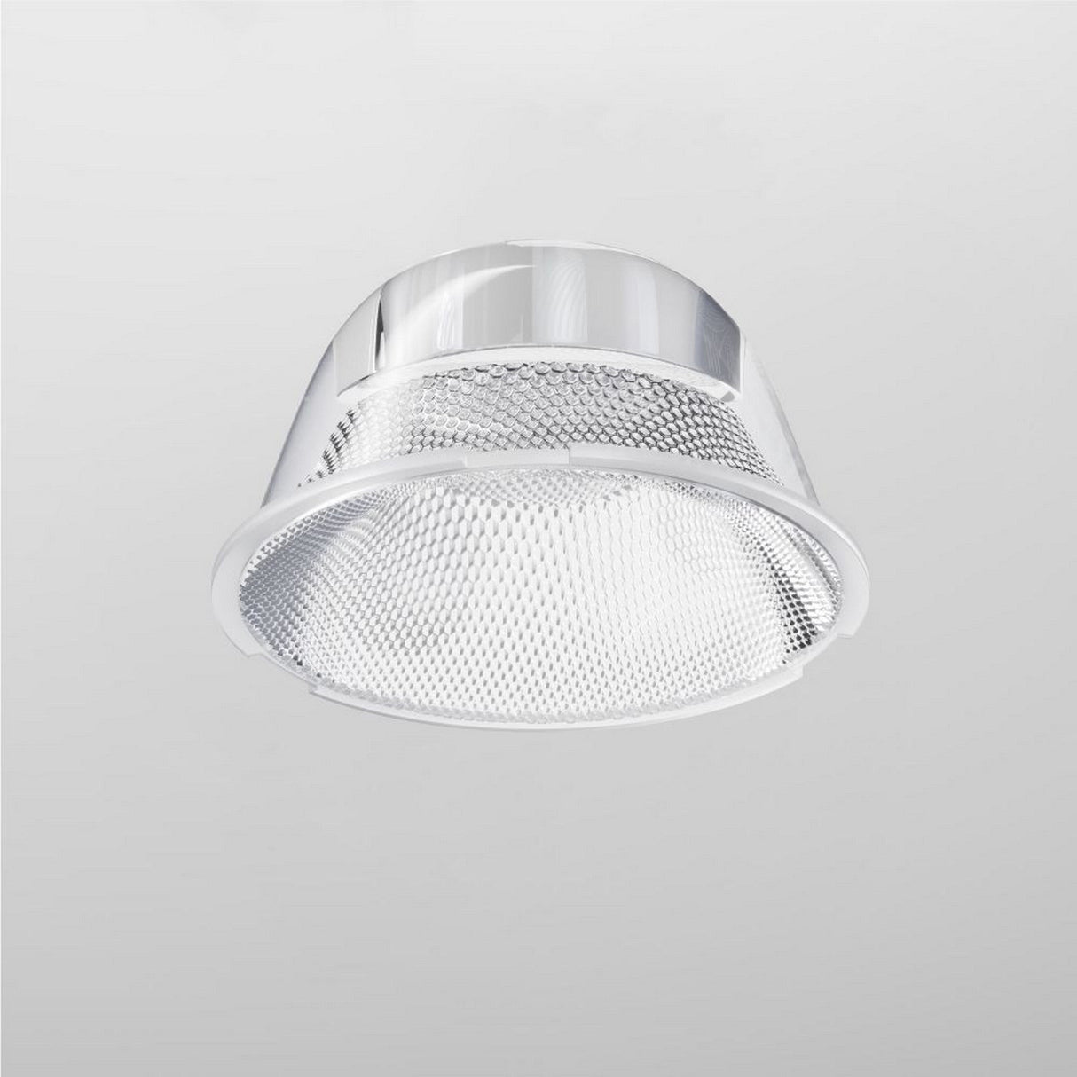 The Focus LED Track Light Lens ⌀43mm 24° is a modern silver recessed ceiling fixture with a mesh-like grill, ideal for task lighting. It is featured against a white ceiling, highlighting its metallic design and reflective surface while the light remains off.
