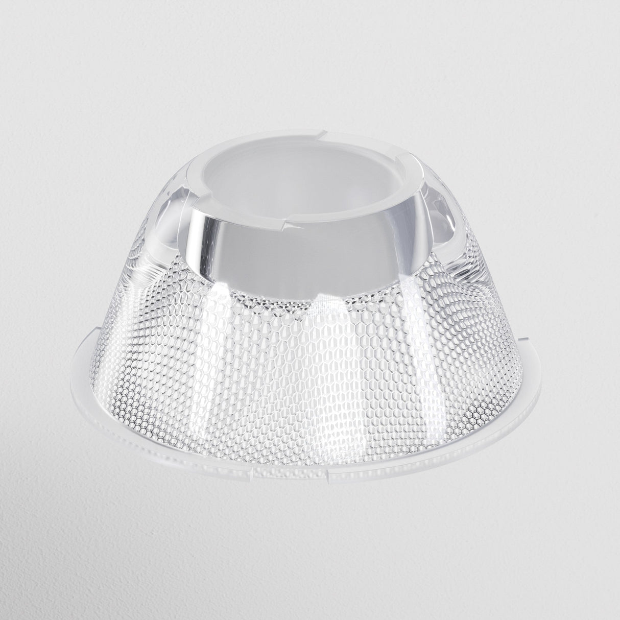 A silver Focus LED Track Light Lens, ⌀43mm with a reflective honeycomb texture on a plain white background. Dome-shaped and tapering to an open circular top, it offers ideal ambient lighting with a versatile 36° beam angle.