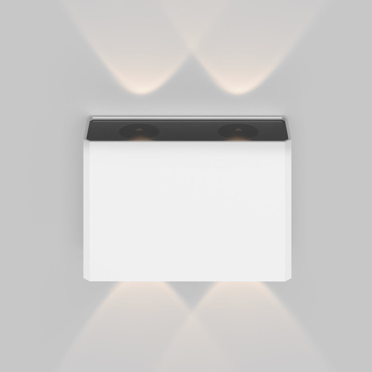 The Show Outdoor Wall Light 3000K - White, mounted on a gray wall, casts soft, warm light upward and downward, creating overlapping patterns. It features a thin black border with an energy-efficient LED and boasts a weather-resistant design for durability in various conditions.