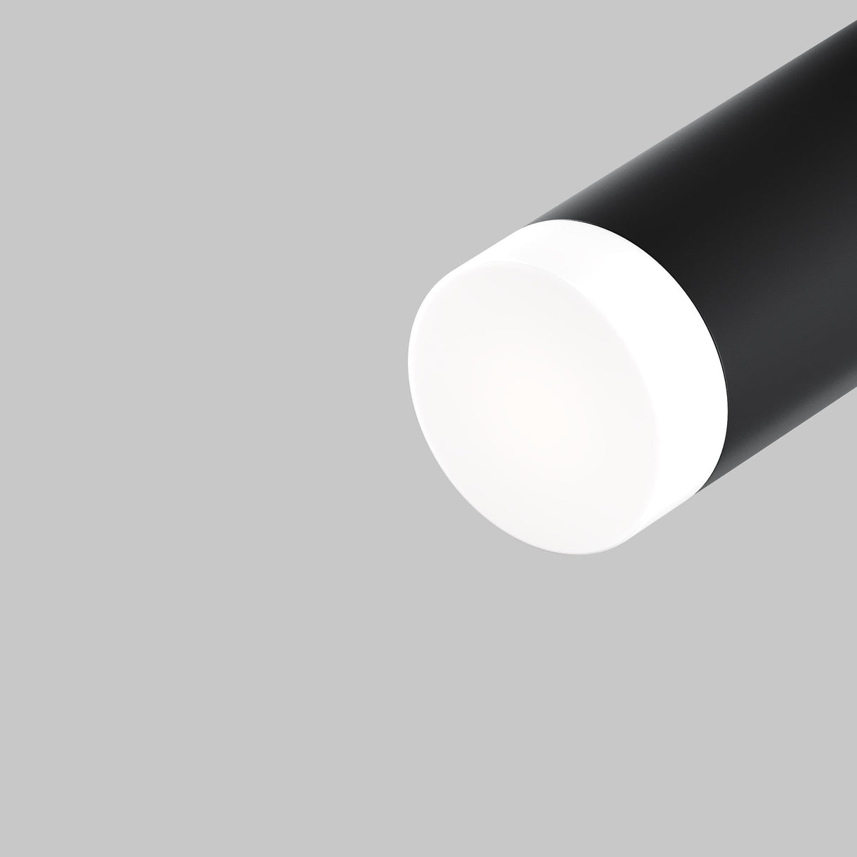 The Focus LED Light Diffuser Small 5W features a sleek, modern design with a cylindrical black tube and a white semi-transparent cap. It provides glare-free lighting against a plain gray background, creating an elegant contrast.
