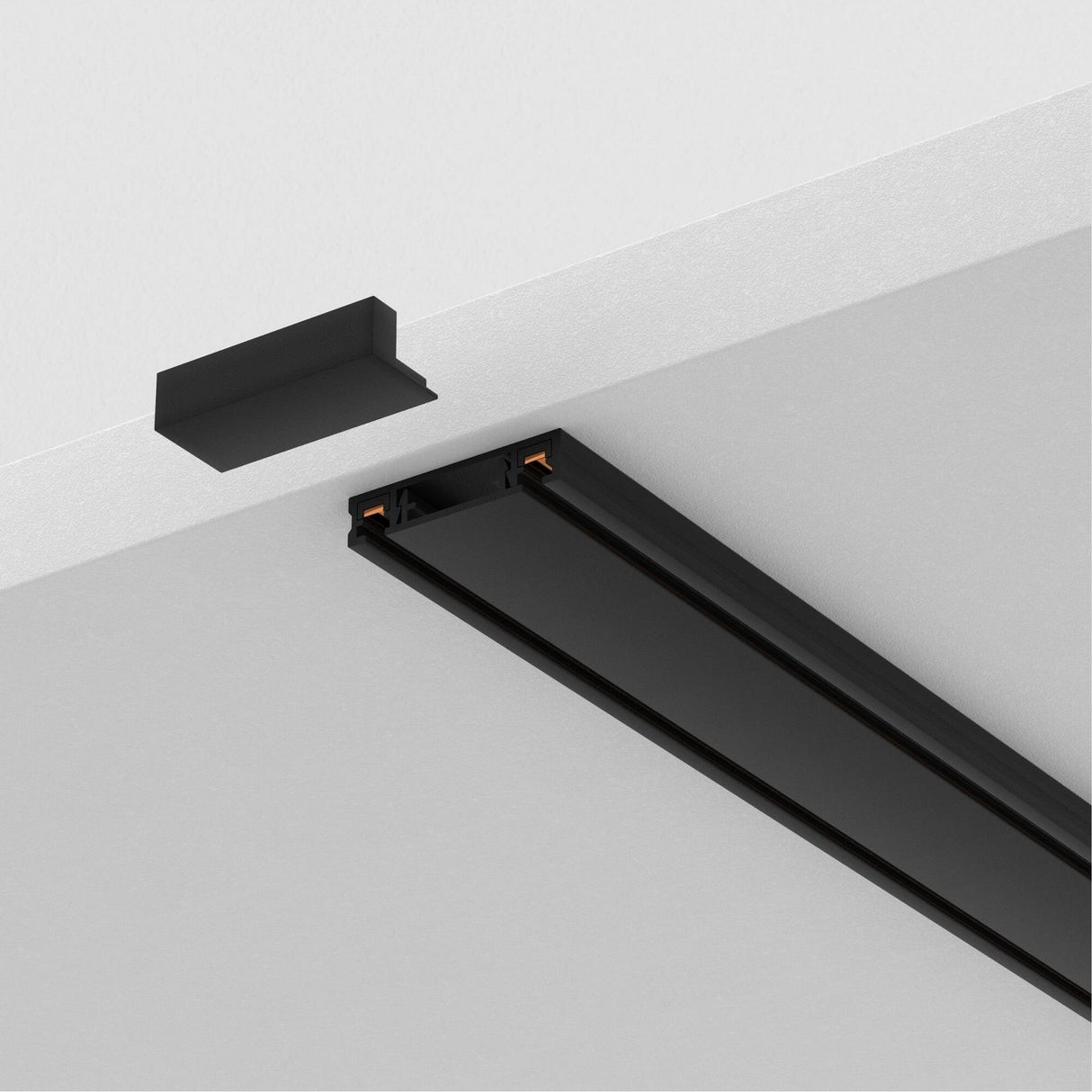 The Radity Magnetic Surface-Mounted Track 1m in black hangs from the ceiling with one end slightly detached to show electrical connectors, while a matching cover is ready for installation. It allows customizable lighting layouts that effortlessly align with your design vision.