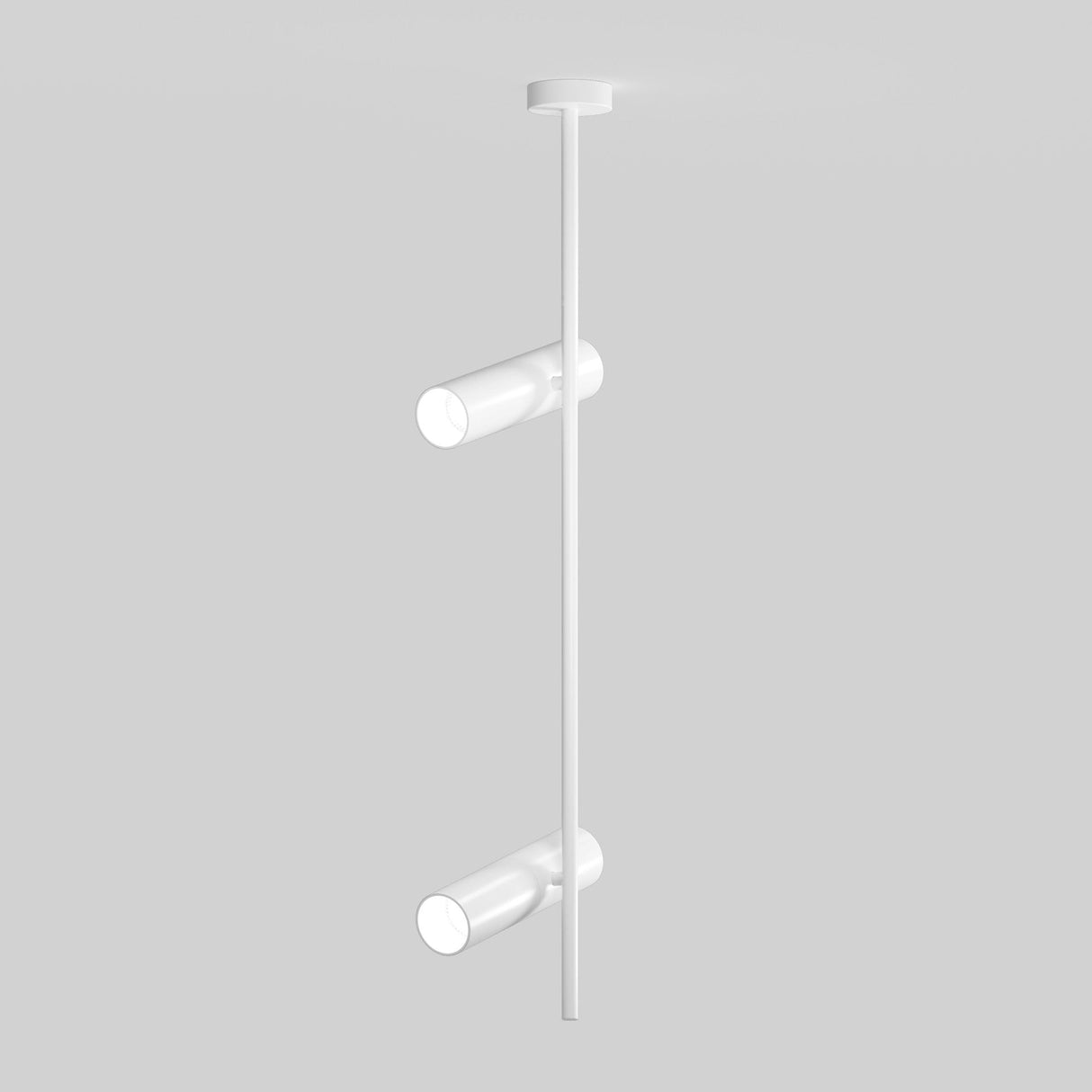 Introducing the Elti Twin Spotlight - White: a minimalist ceiling light with a modern design ideal for contemporary interiors. It features two adjustable cylindrical lights on a vertical rod against a plain gray background, providing versatile illumination.
