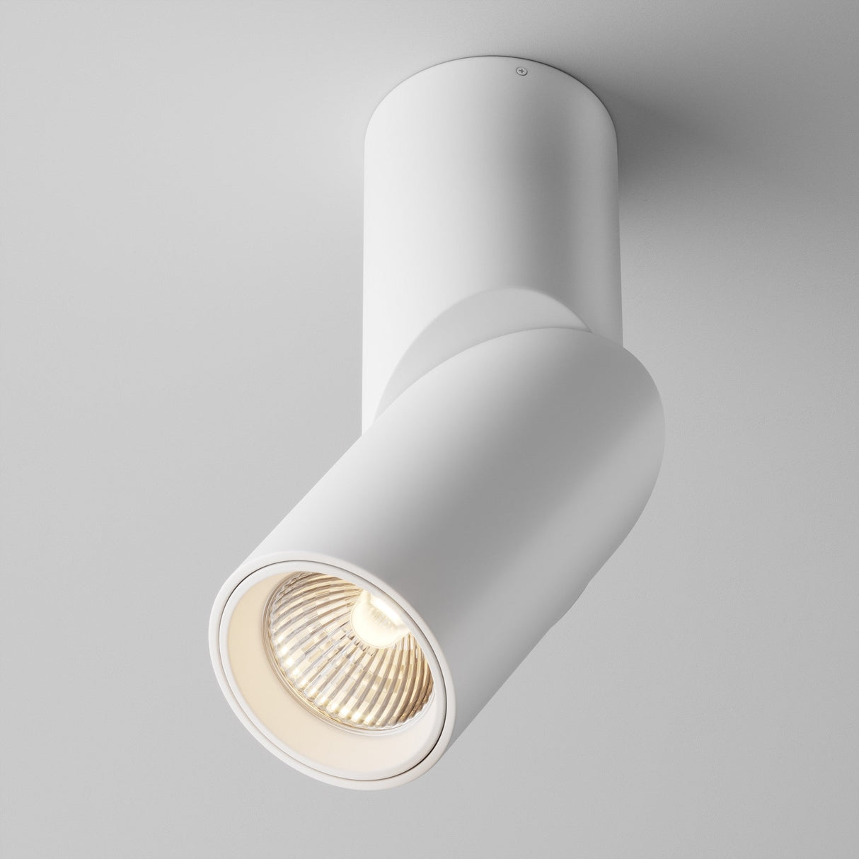 The Dafne LED Single Spotlight 10W 3000K in white is a cylindrical ceiling fixture with energy-efficient LED technology and a swiveling head that casts a focused warm light downward.