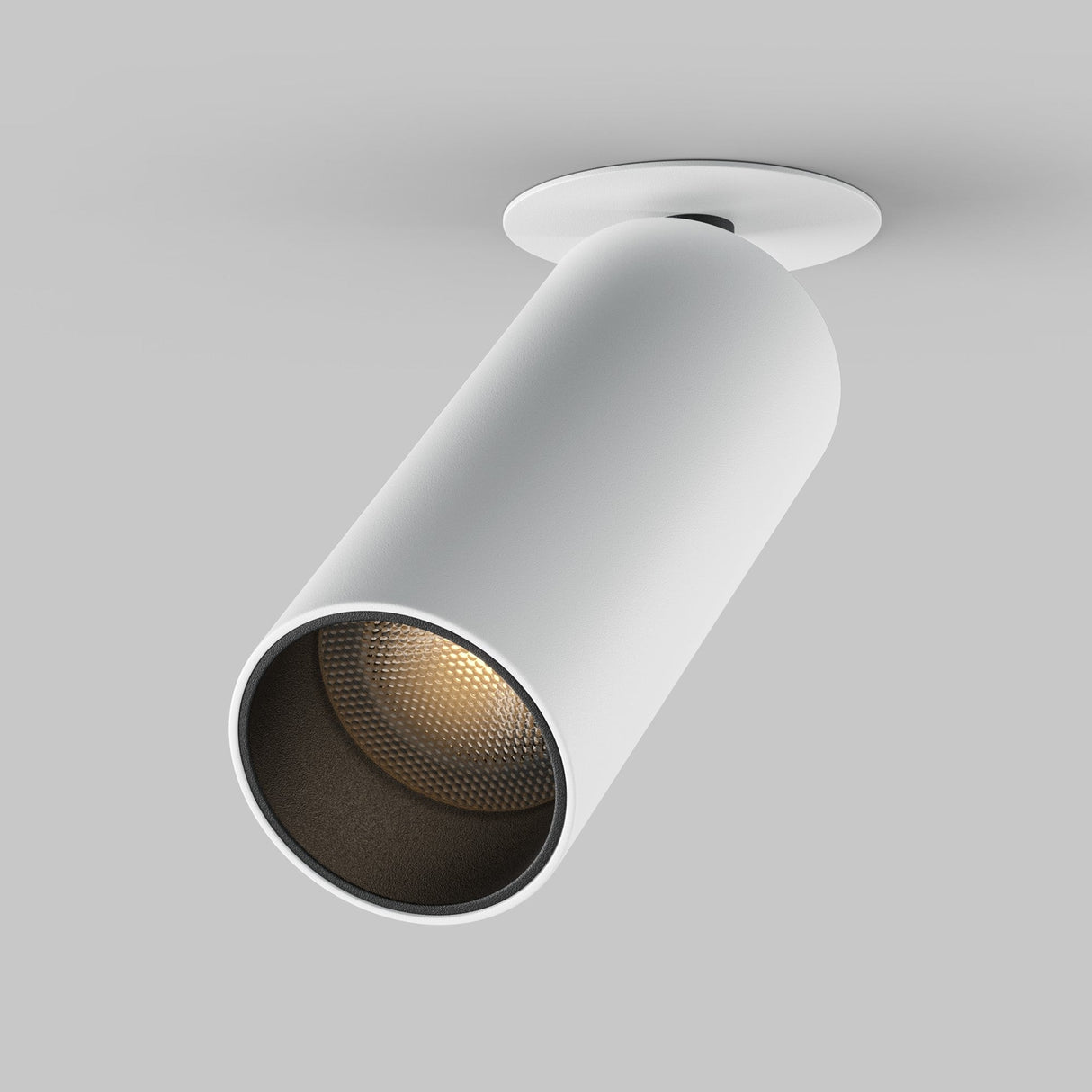 The Focus LED Single Recessed Spotlight 12W 3000K - White is a contemporary cylindrical ceiling light featuring energy-efficient LED technology, angled downward with a textured interior on a round base, ideal for modern interiors against a gray background.