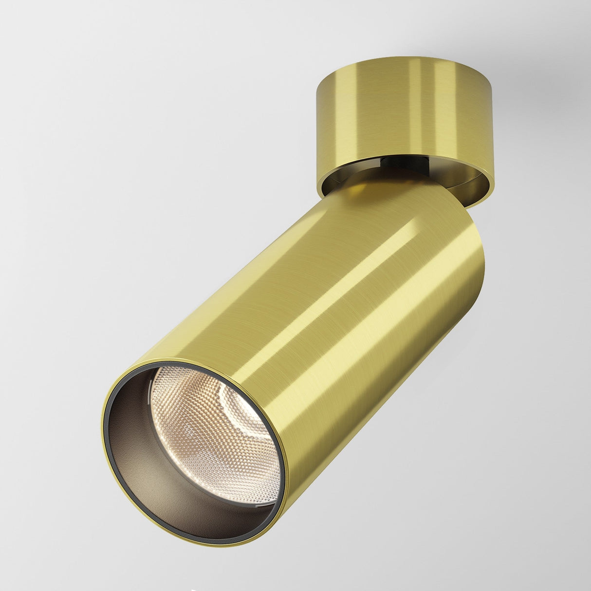 The Focus LED Single Surface-Mounted Spotlight 12W 3000K in brass is a modern, cylindrical ceiling light fixture with an adjustable design, featuring an energy-efficient LED spotlight and sleek metallic finish for direct downward lighting.