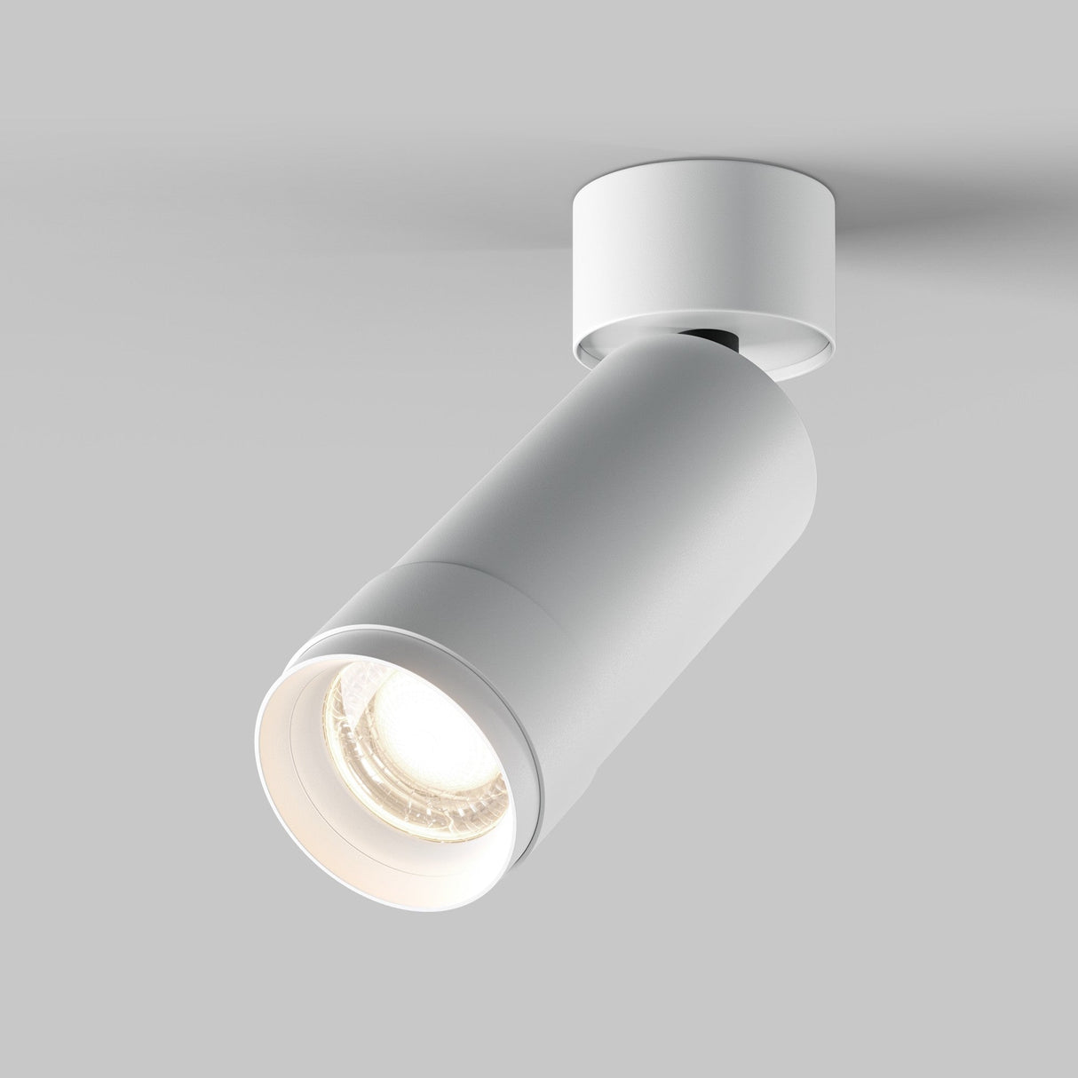 The Focus Zoom LED Single Surface-Mounted Spotlight 12W 4000K - White features a sleek cylindrical design and adjustable beam angle for optimal neutral background illumination, with a high CRI rating ensuring vibrant, true-to-life color representation.