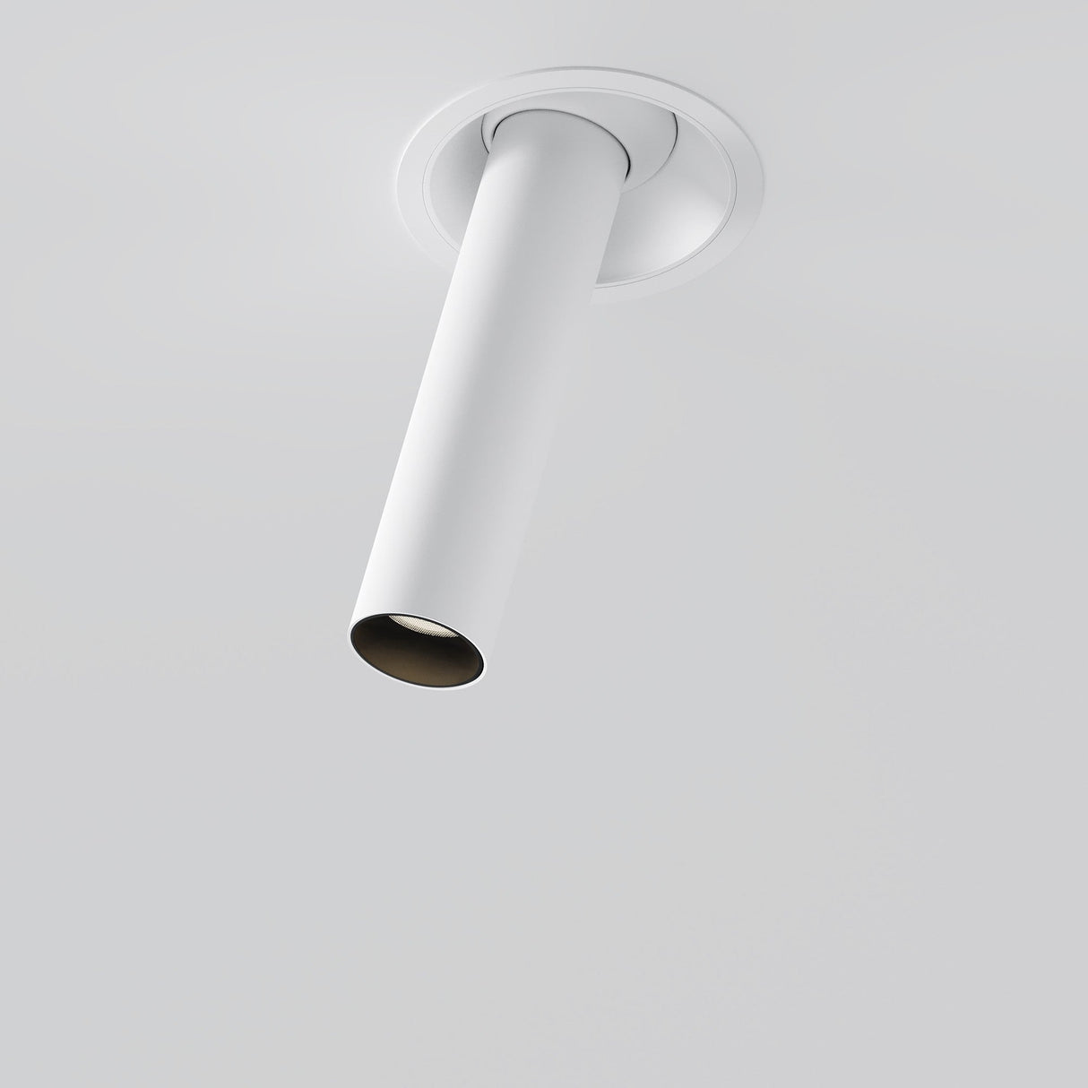 The Focus T LED Adjustable Short Retractable In-Out Recessed Downlight 7W 3000K in white is a ceiling-mounted, retractable cylindrical fixture set against a light gray backdrop. Its sleek, modern design ensures energy-efficient lighting with an angled downlight configuration.