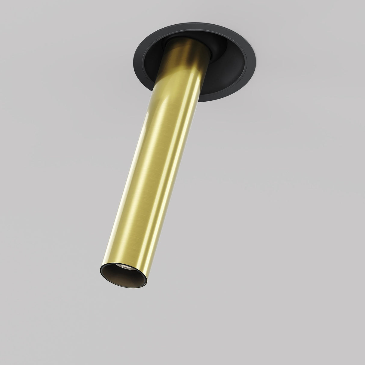 The Focus T LED Adjustable Downlight in black and brass features a sleek, speaker-like design. It retracts into a gray ceiling, showcasing its minimalist and modern aesthetic. Perfect for stylish interiors, this 7W 3000K light adds an understated elegance with its cylindrical look and trim ring.