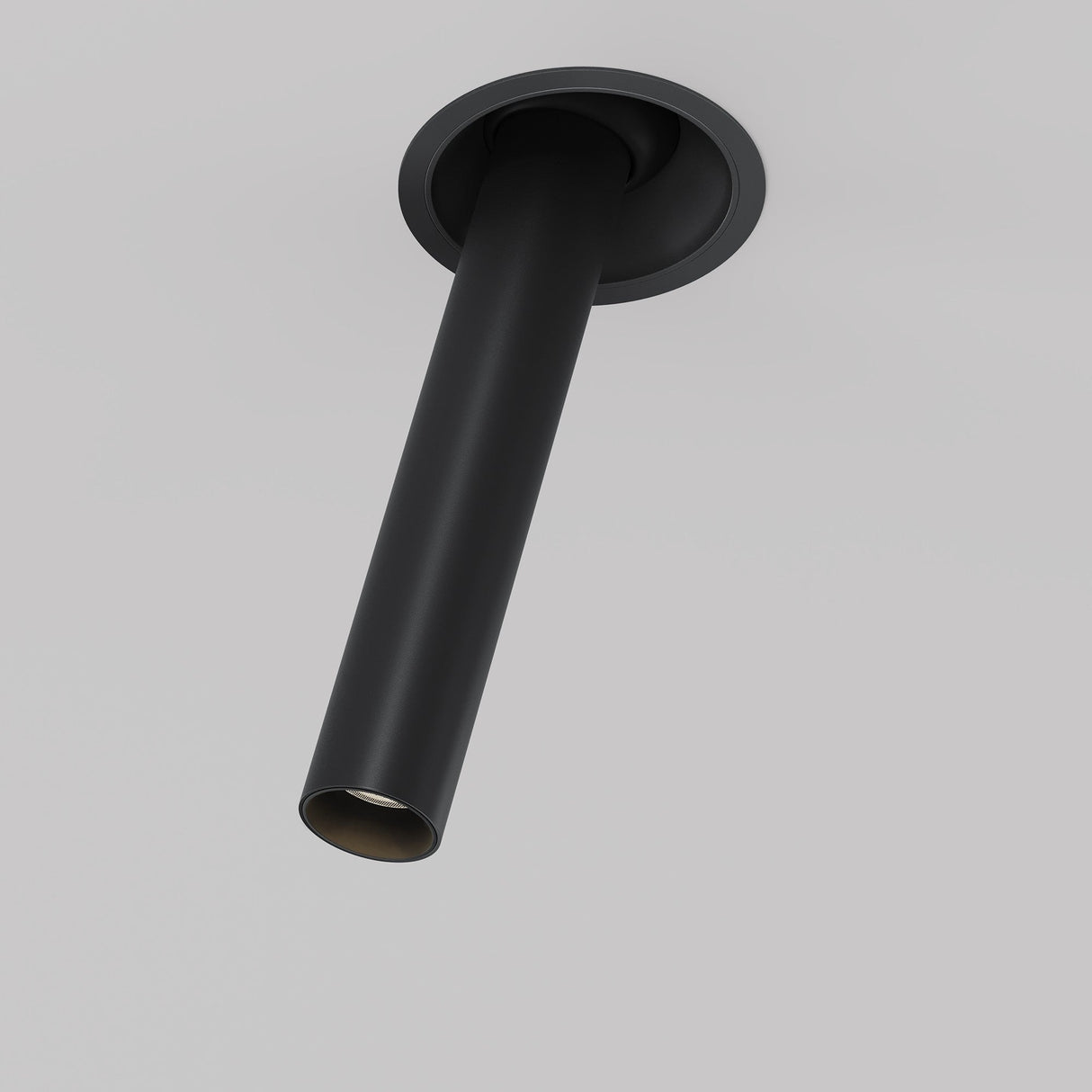 The Focus T LED Adjustable Long Retractable In-Out Recessed Downlight 7W 3000K in black features a sleek, modern design with a cylindrical shape and narrow beam opening, protruding slightly from a smooth gray ceiling for precise illumination.