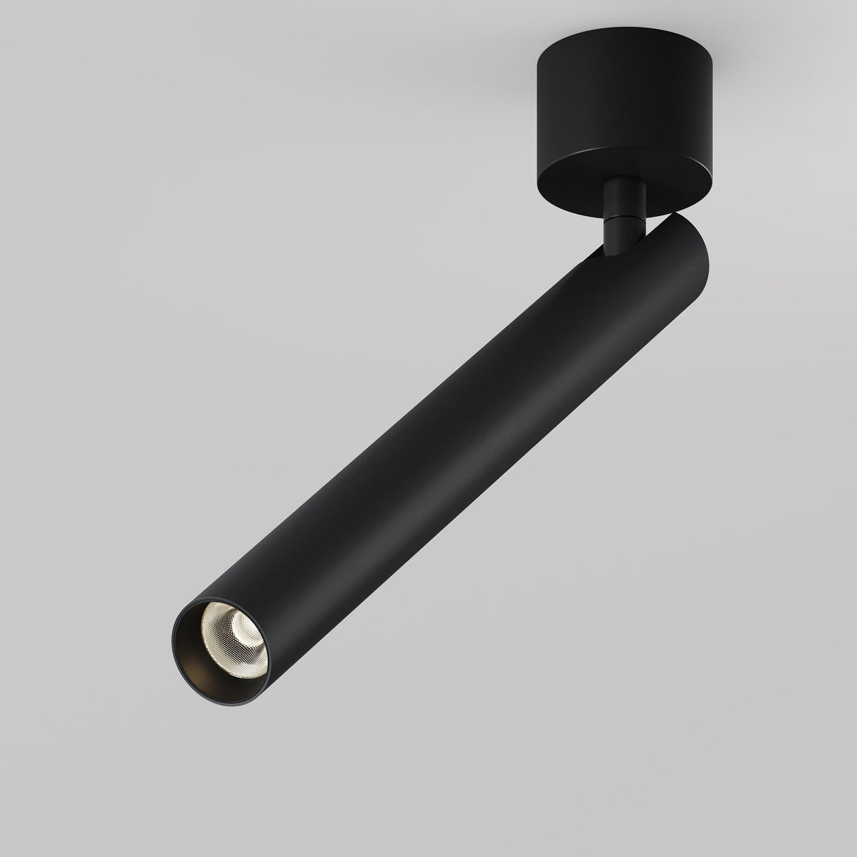 The Focus T LED Long Single Spotlight 6W 3000K in black is a modern, ceiling-mounted cylindrical light with a sleek design, attached to a round base. It extends diagonally for energy-efficient lighting, perfect for modern interiors, set against a plain gray background.