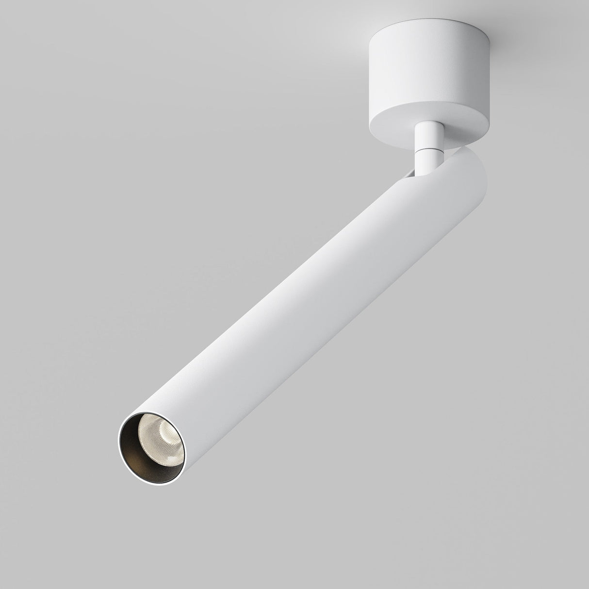 The Focus T LED Long Single Spotlight 6W 3000K - White is a sleek, modern ceiling-mounted track light with a white cylindrical design. Its Scandinavian style and angled extension make it an elegant accent lighting solution for contemporary spaces, featuring a round bulb at the end.