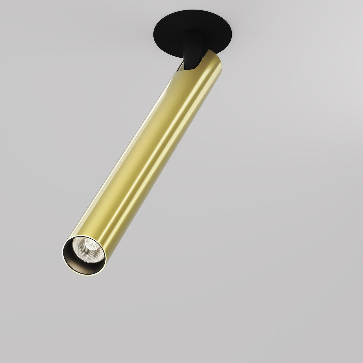 The Focus T LED Adjustable Long Recessed Downlight 6W 3000K in black and brass features a modern cylindrical spotlight with a gold finish, mounted on its base. Its sleek, minimalist design casts a warm white light against a plain white background, angled downward for emphasis.