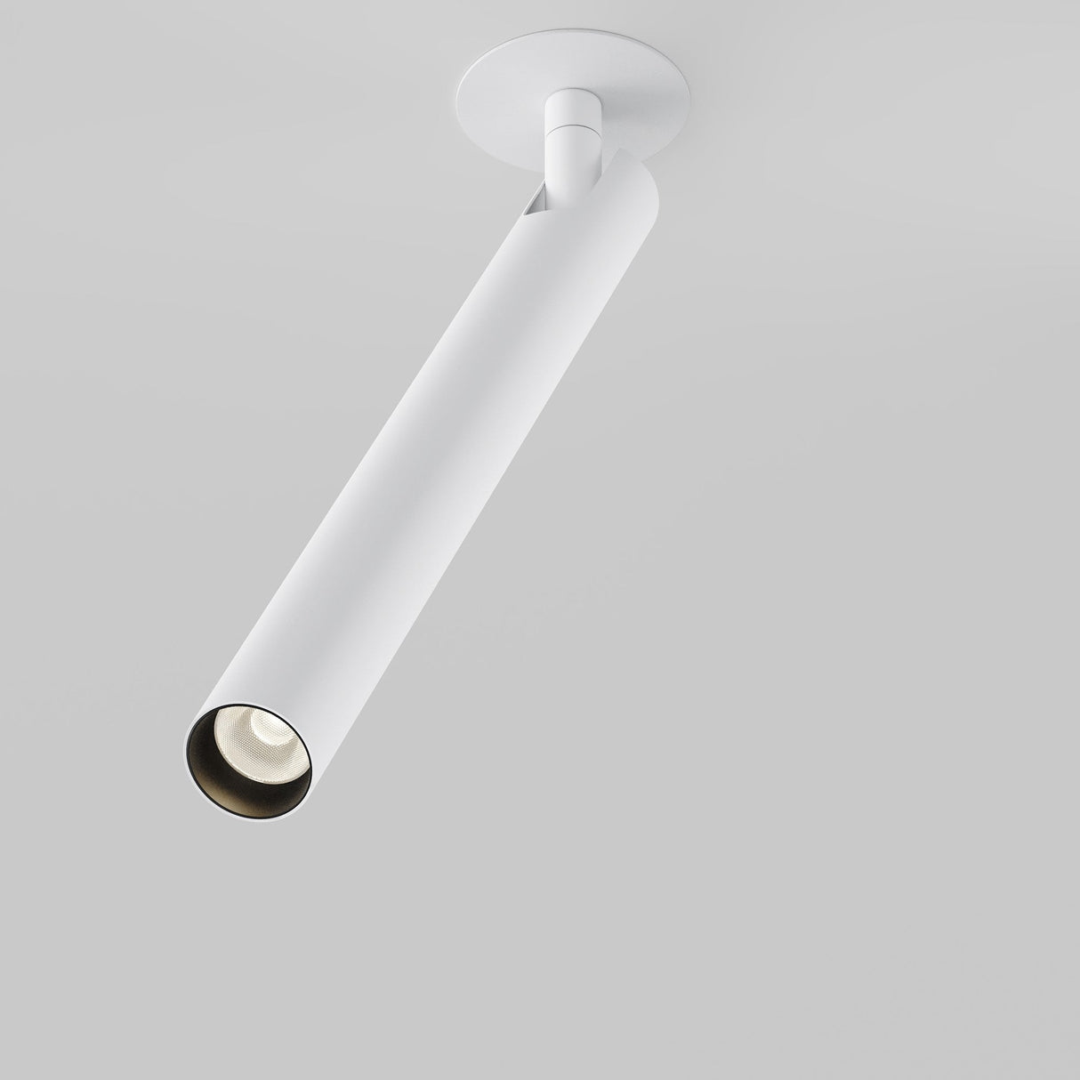 The Focus T 6W LED Adjustable Long Recessed Downlight in white, featuring a cylindrical spotlight with an adjustable head, is mounted on the ceiling. This energy-efficient fixture illuminates downward against a smooth, light gray background.