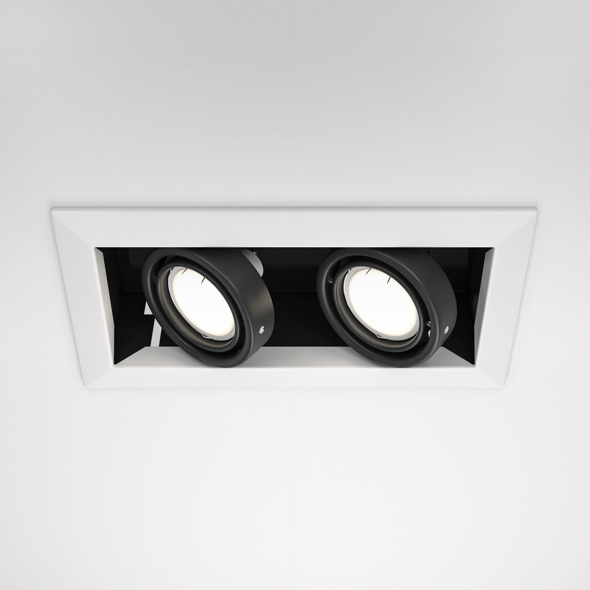 A modern rectangular recessed ceiling fixture, the Metal Modern Twin Tilt Downlight in white features adjustable black spotlights and is viewed from below.
