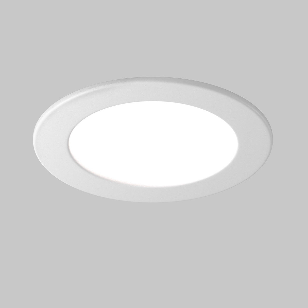 The Stockton CCT LED Round Recessed Downlight 18W 3000-6000K - White is showcased against a gray background. This modern, circular fixture allows for customizable ambiance with its energy-efficient colour temperature control.