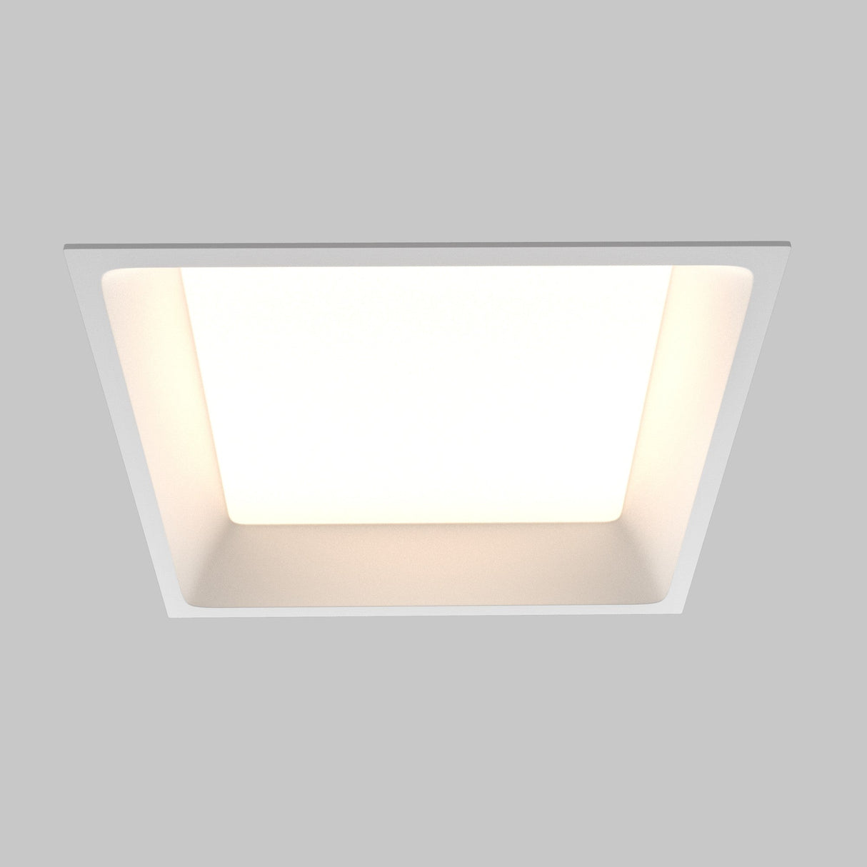 The Okno CCT LED Square Recessed Downlight 24W 3000-6000K in White provides bright, even illumination against a light gray background. This ceiling-mounted, energy-efficient fixture offers adjustable color temperature for customizable ambiance.