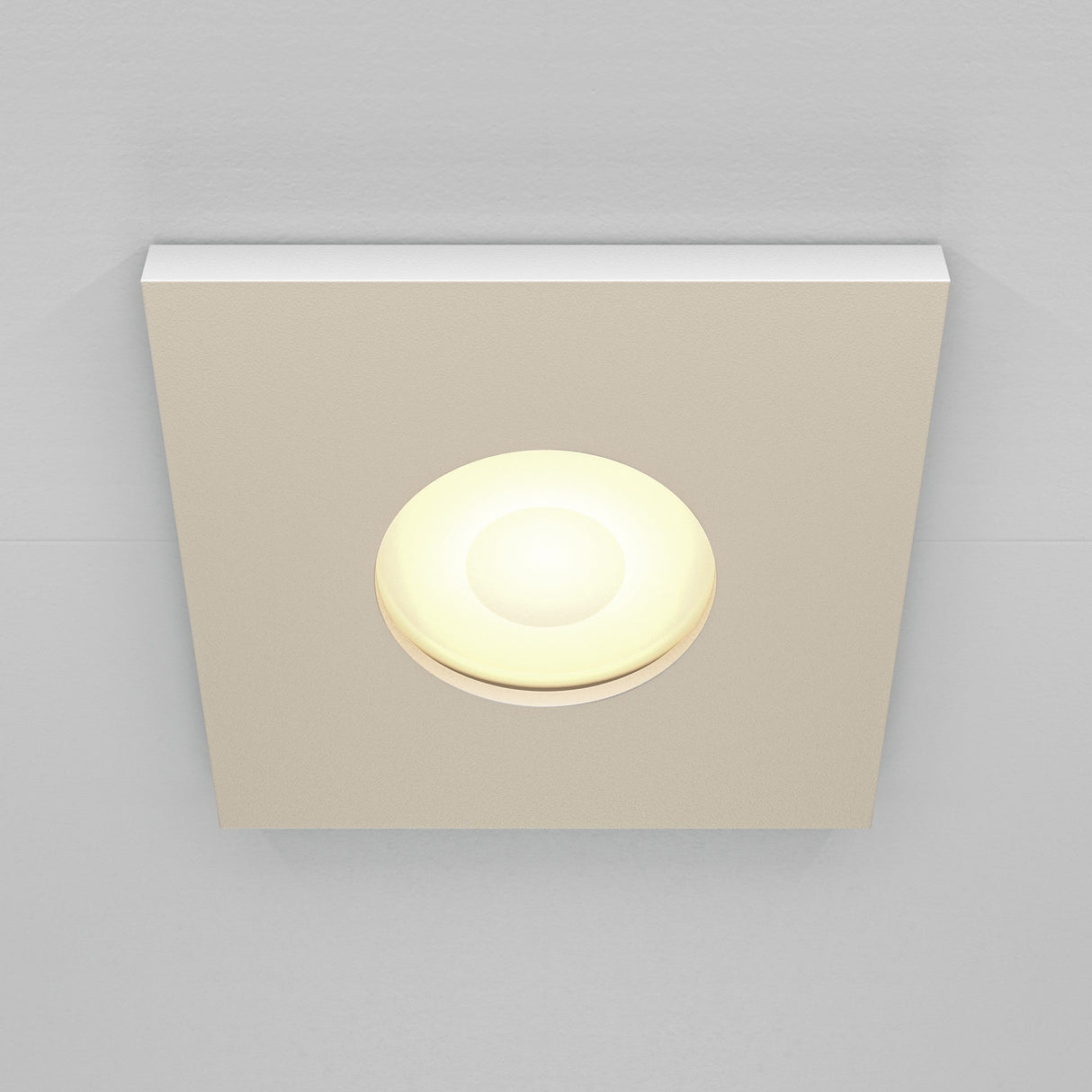 The Stark Fixed Square Recessed Downlight - White features a glowing circular bulb and GU10 bulbs, set against a light gray ceiling.